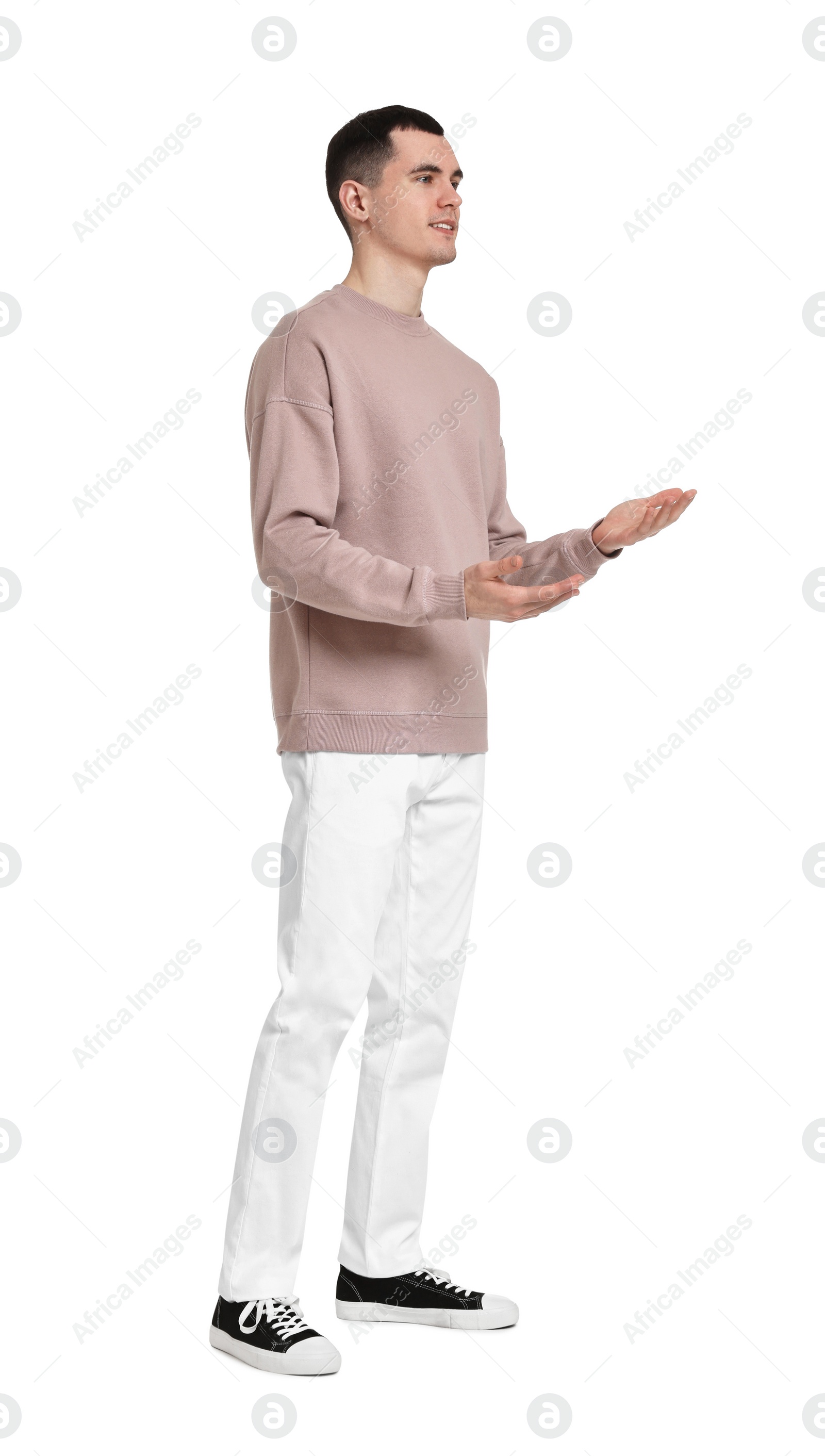 Photo of Full length portrait of handsome young man on white background