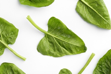 Photo of Fresh leaves of spinach isolated on white, top view