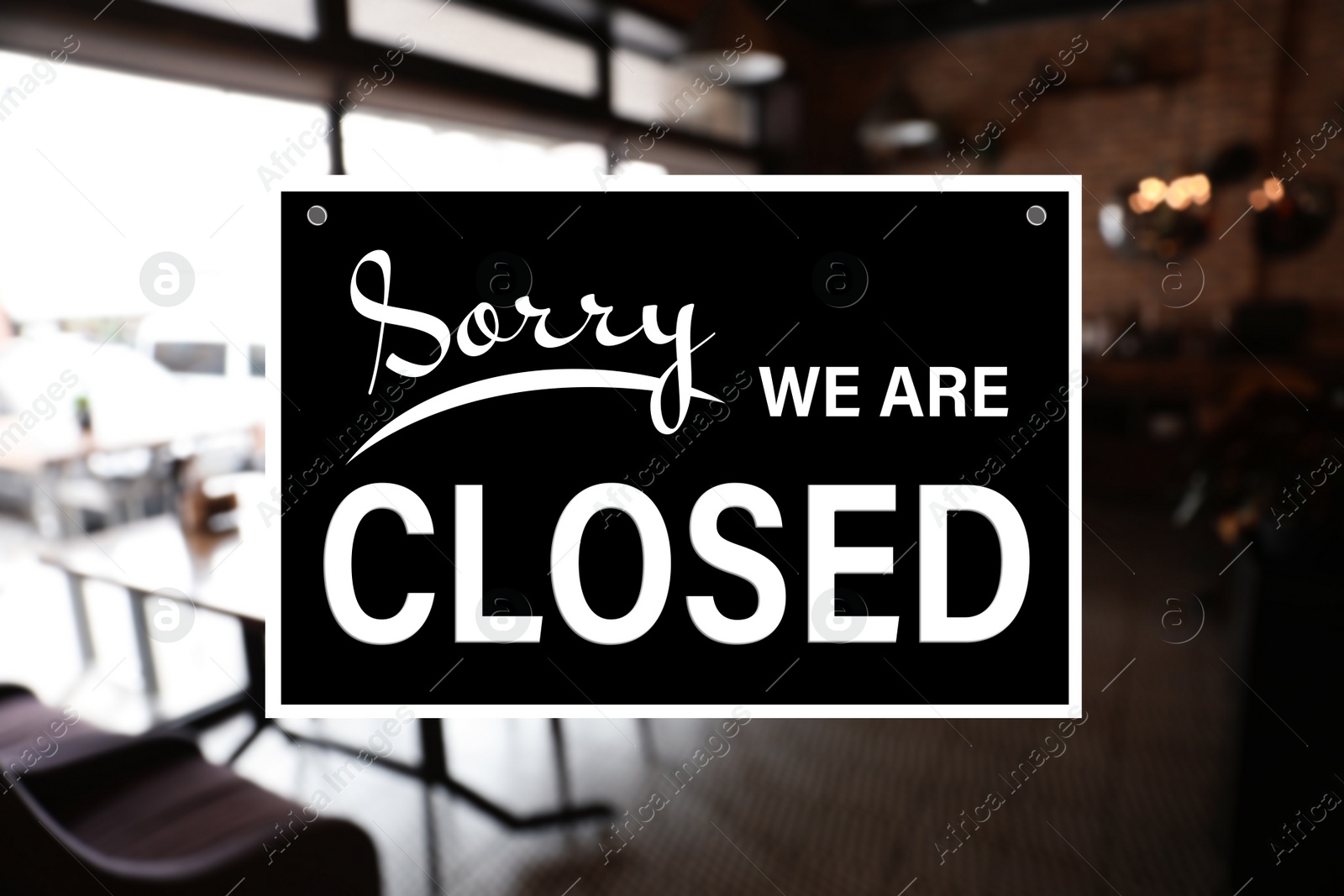 Image of Sorry we are closed sign against blurred background