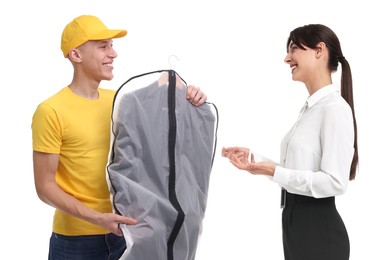 Dry-cleaning delivery. Courier giving garment cover with clothes to woman on white background