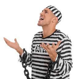 Photo of Emotional prisoner in striped uniform with chained hands on white background