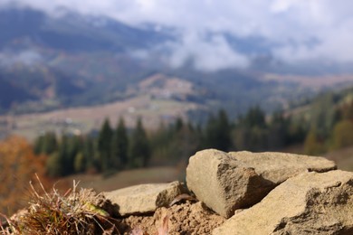 Rocks in mountains on sunny day, space for text