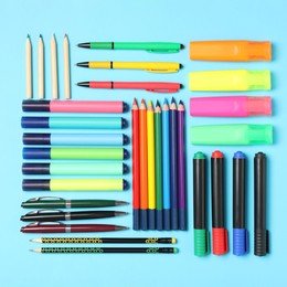 Image of Different stationery on light blue background, flat lay. Back to school