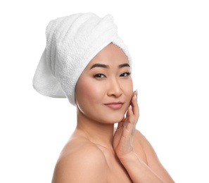 Photo of Portrait of beautiful Asian woman with towel on head against white background. Spa treatment