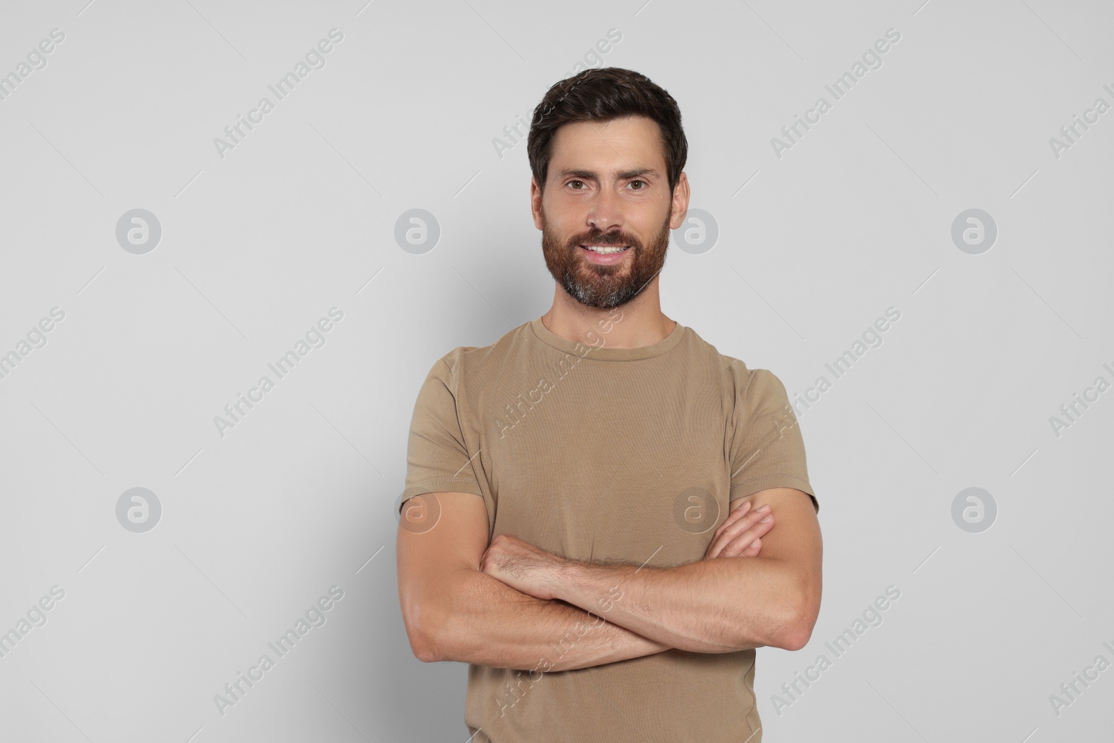 Photo of Portrait of handsome bearded man on white background