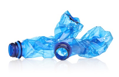 Photo of Crumpled disposable plastic bottles isolated on white