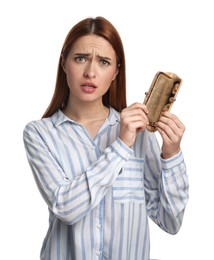 Confused woman with empty wallet on white background