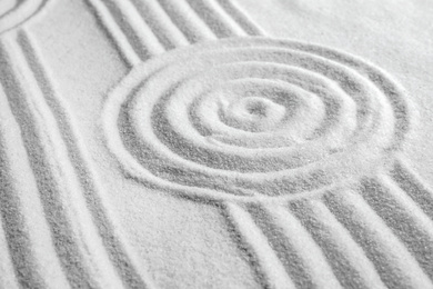 Photo of White sand with pattern as background. Zen, meditation, harmony