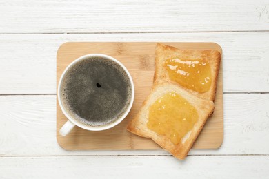 Photo of Tasty breakfast with toasts and coffee on white wooden table, top view