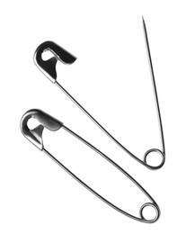 Metal safety pins on white background, top view