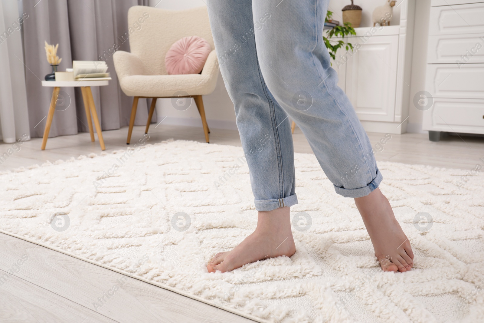 Photo of Woman standing on beige carpet in room, closeup. Space for text