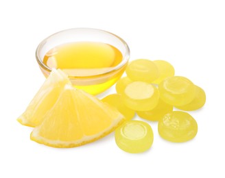 Photo of Many color cough drops, slice of orange and honey on white background