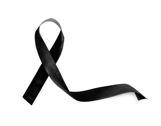 Photo of Black ribbon on white background. Funeral accessory