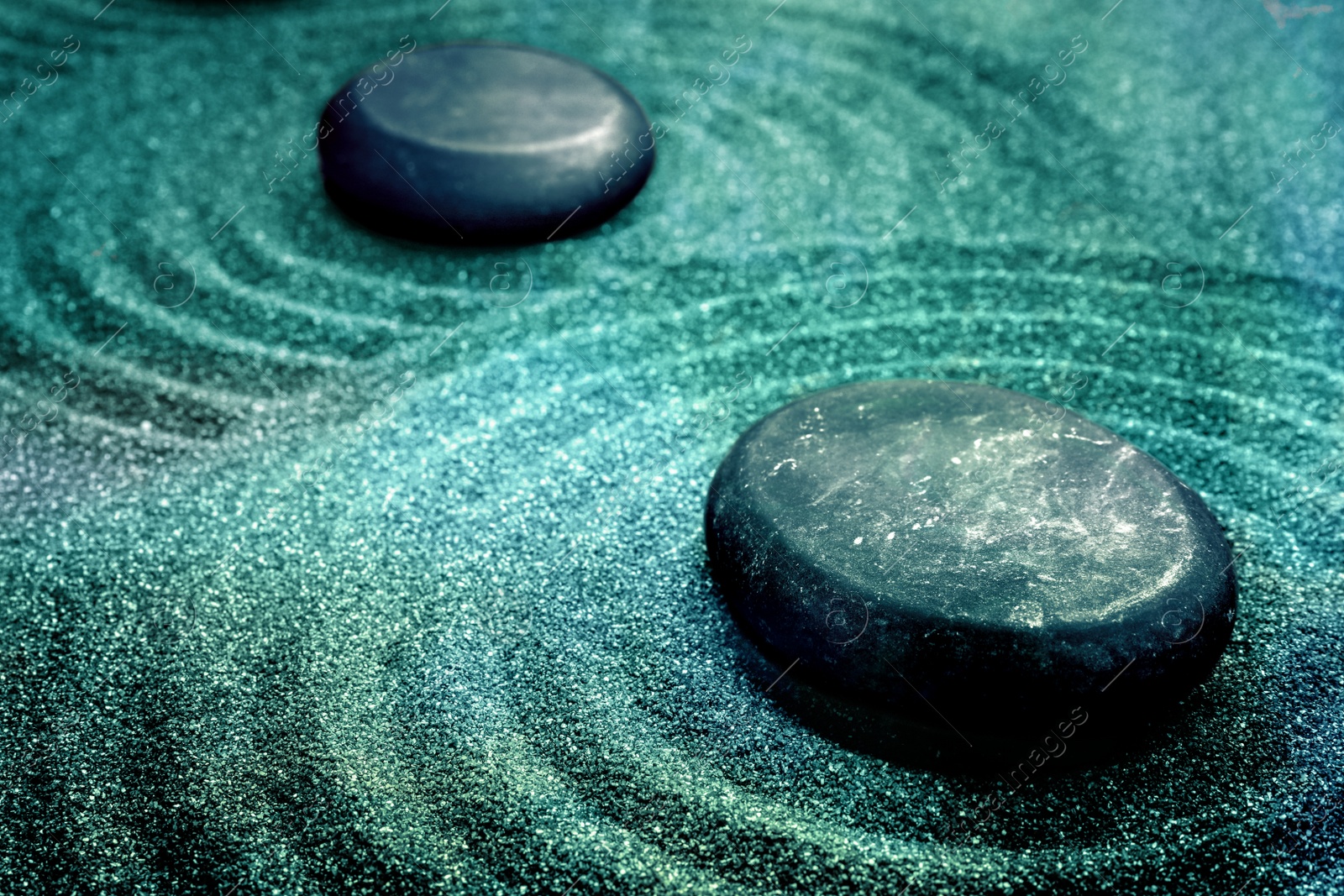 Image of Sand with stones and beautiful pattern. Zen concept