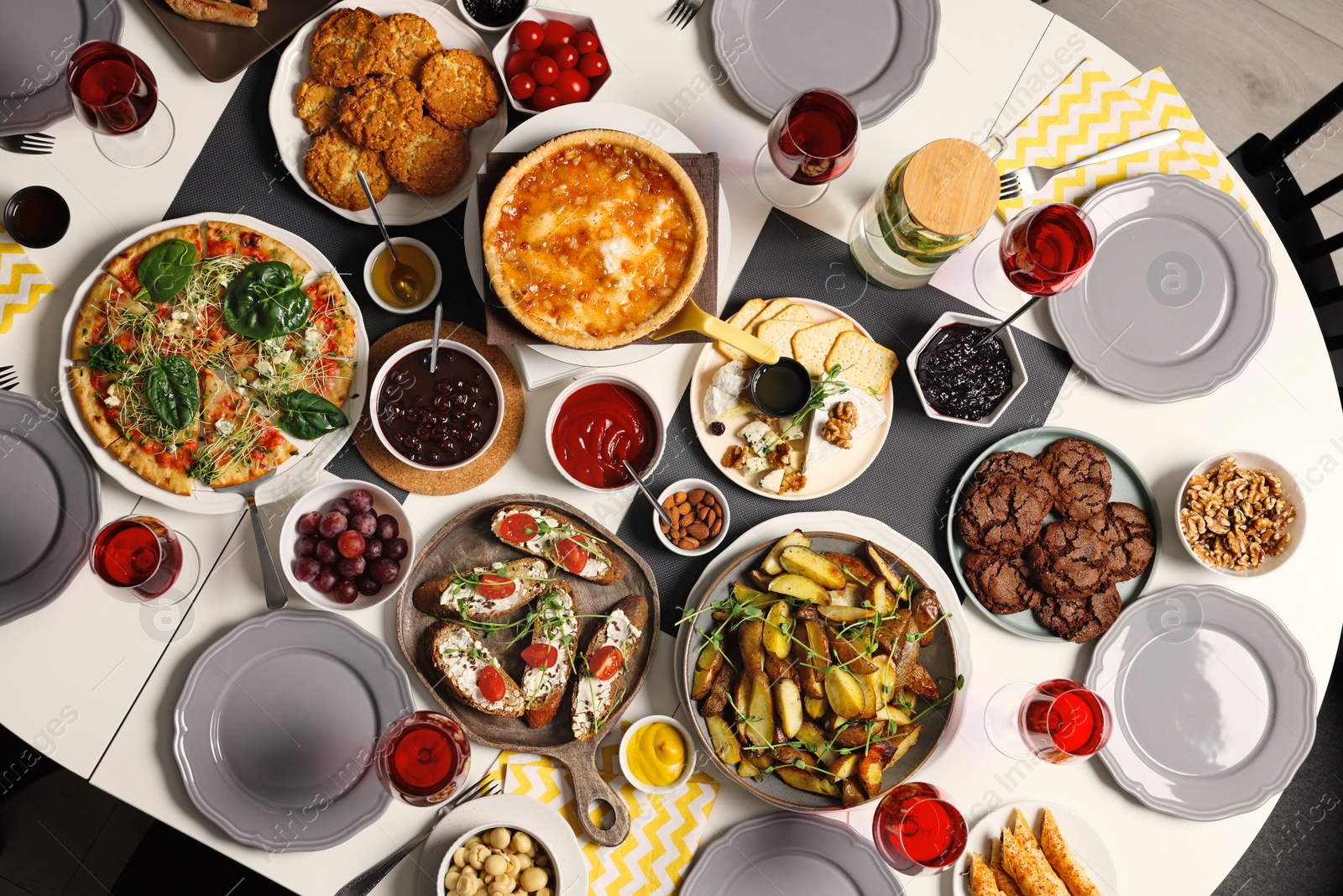 Photo of Brunch table setting with different delicious food indoors, top view