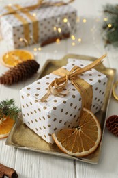 Photo of Composition with christmas gift box on white wooden table, closeup