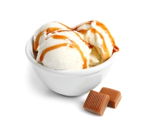 Photo of Tasty ice cream with caramel sauce in bowl and candies on white background