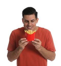 Man with French fries on white background