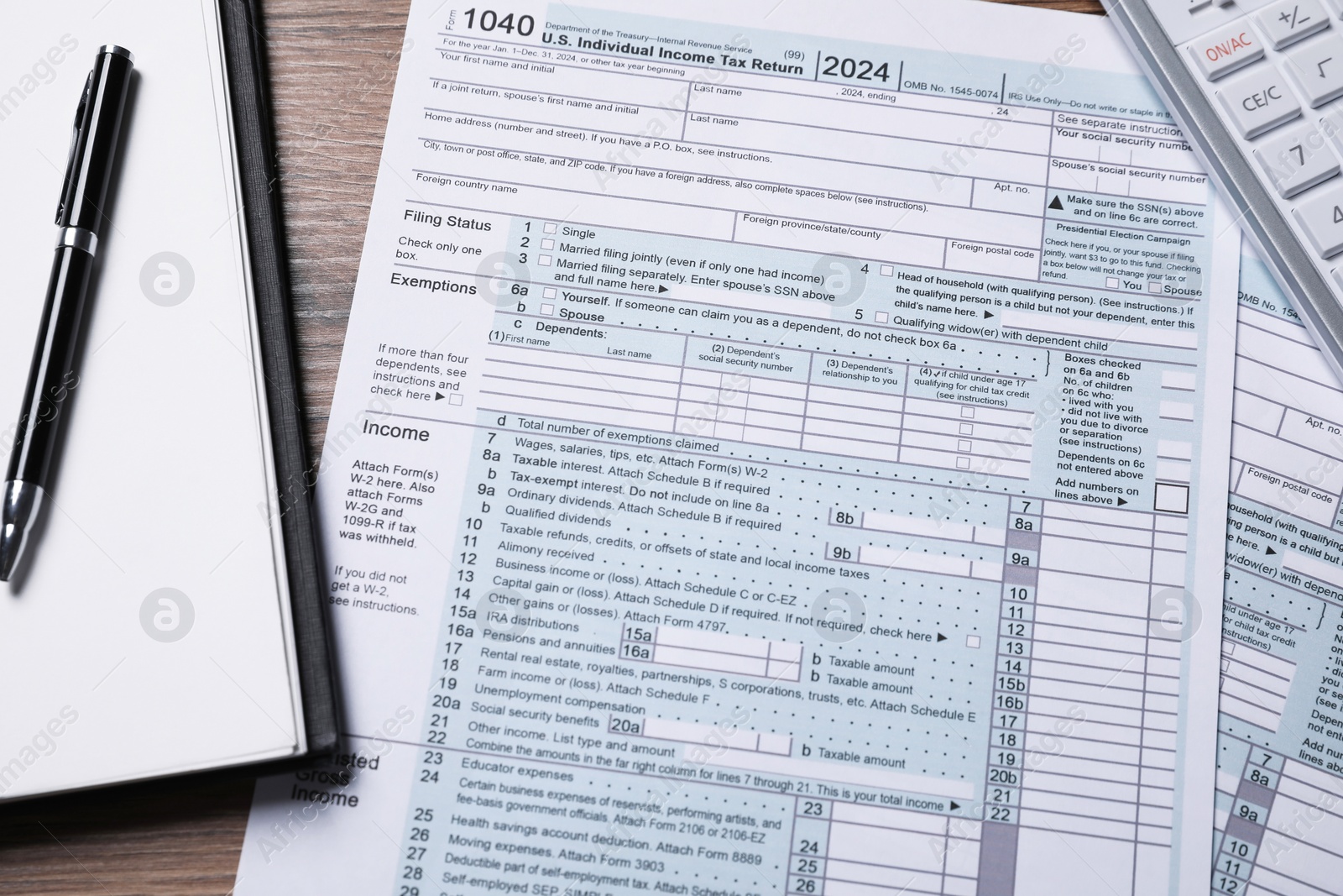 Photo of Payroll. Tax return forms, notebook and pen on wooden table, flat lay