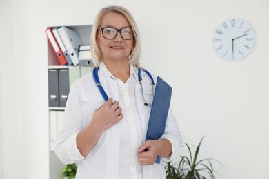 Professional doctor in uniform with stethoscope in clinic