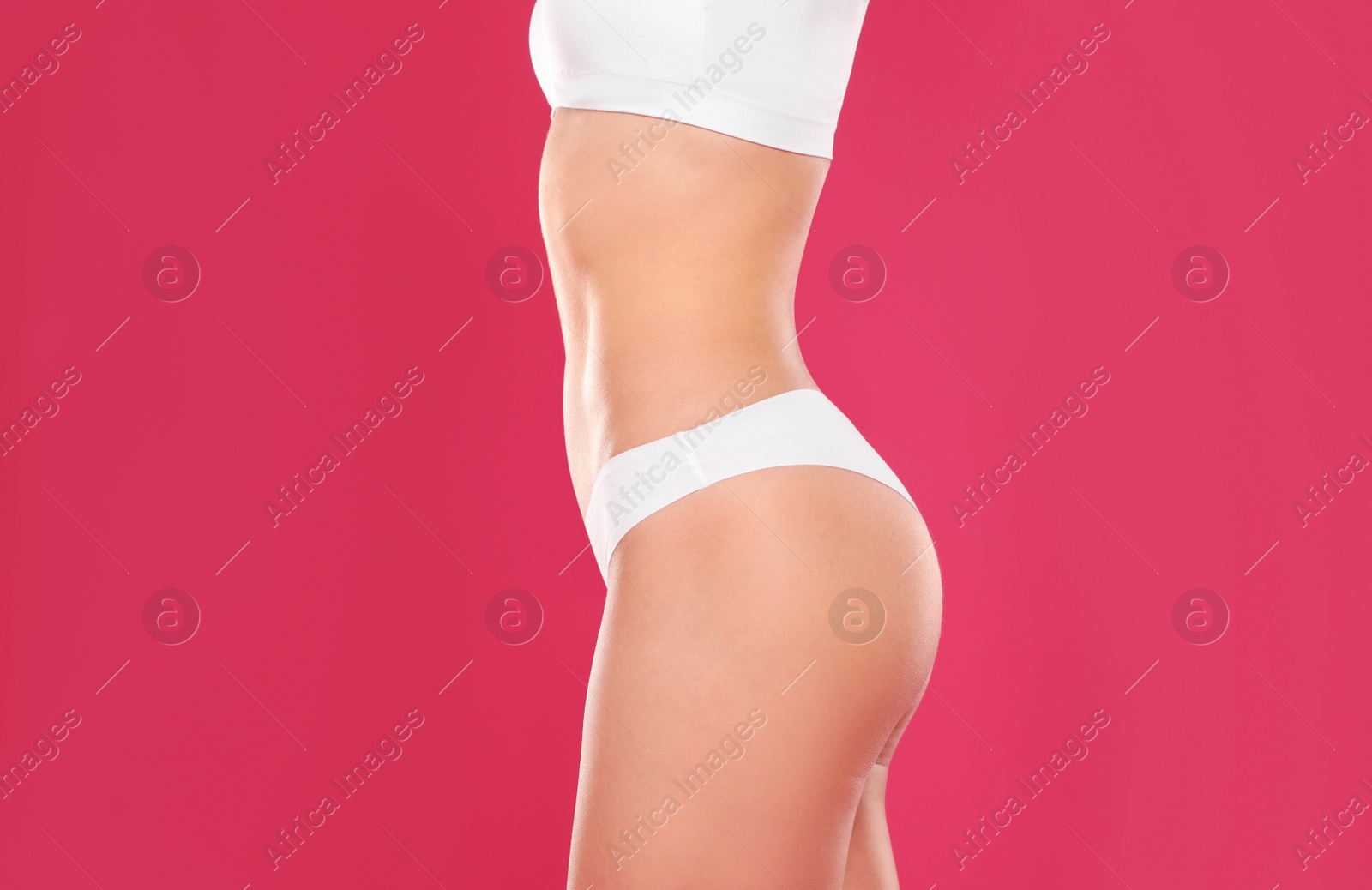 Photo of Slim young woman with smooth gentle skin on color background, closeup. Beauty and body care concept