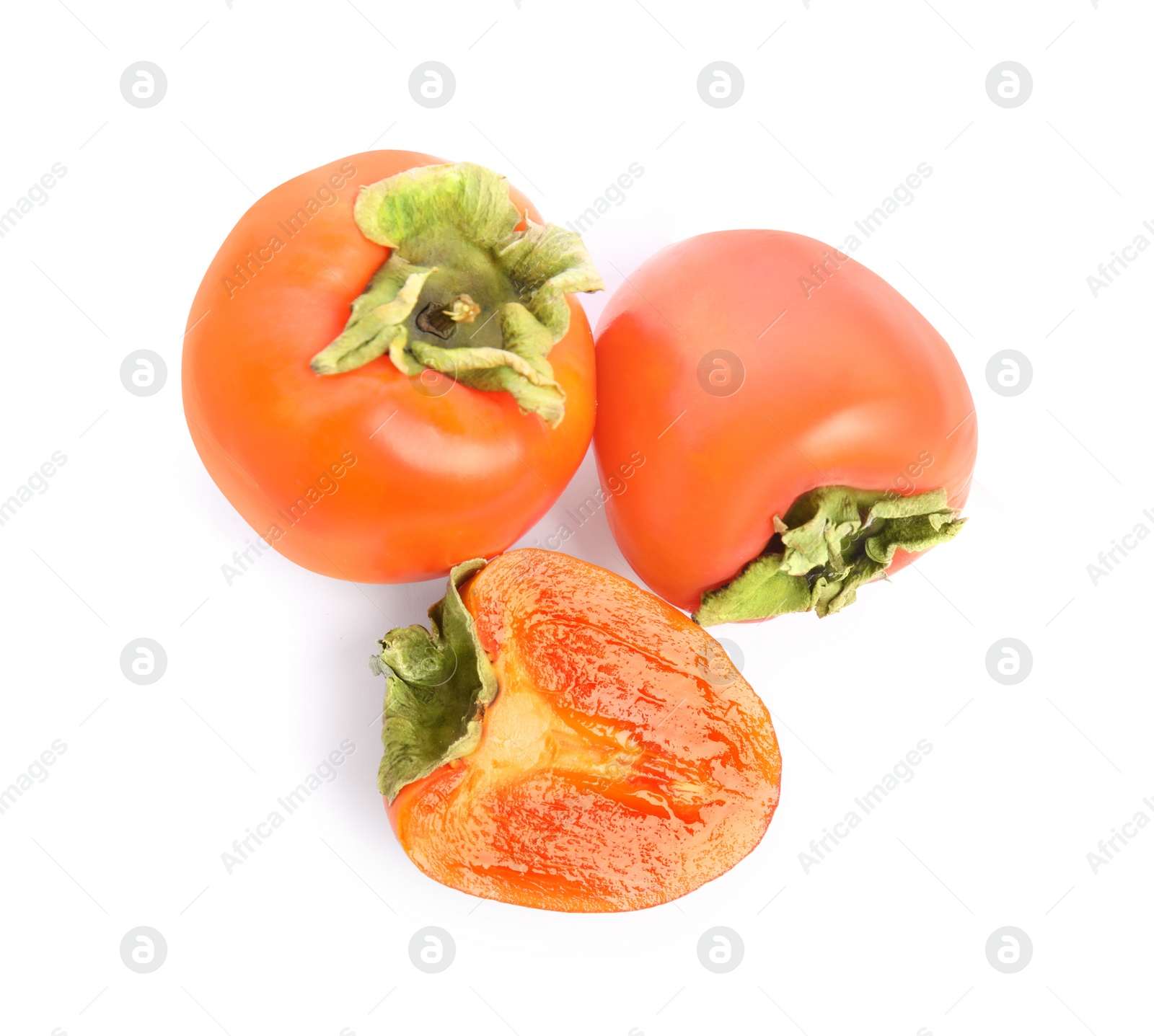 Photo of Delicious cut and whole fresh persimmons isolated on white, top view