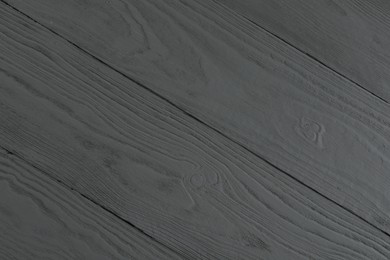 Photo of Texture of grey wooden surface as background, closeup