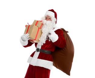 Photo of Santa Claus with sack and gifts on white background