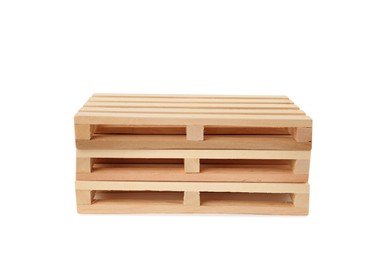 Photo of Stack of small wooden pallets on white background