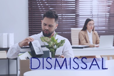 Dismissed man packing personal stuff into box in office