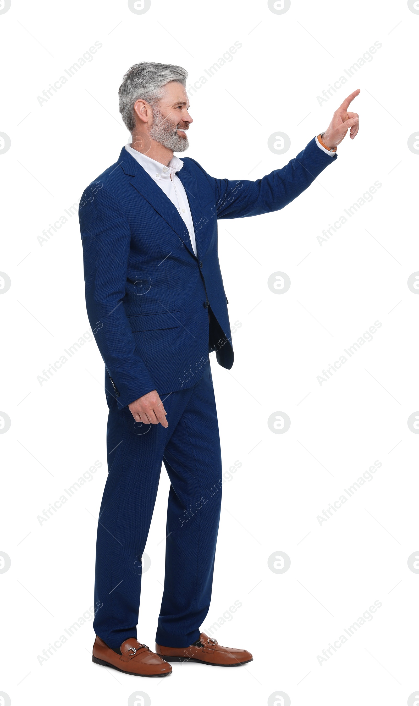 Photo of Mature businessman in stylish clothes posing on white background