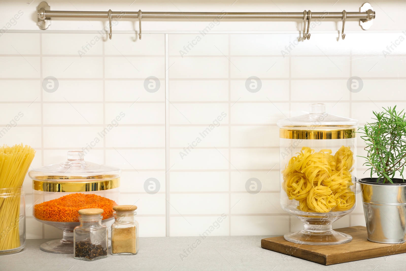 Photo of Products in modern kitchen utensils on table