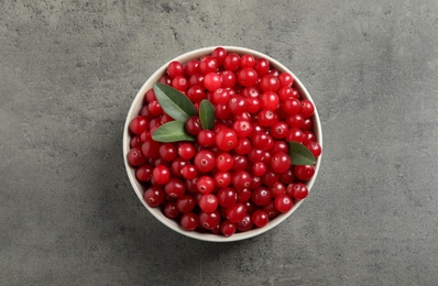 Ripe fresh cranberry on grey table, top view