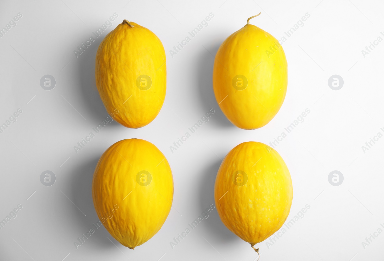 Photo of Flat lay composition with melons on white background