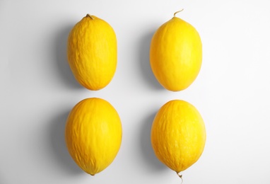 Flat lay composition with melons on white background