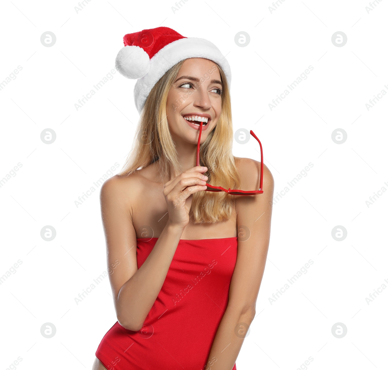 Photo of Young woman wearing Santa Claus hat on white background. Christmas vacation