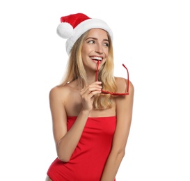 Photo of Young woman wearing Santa Claus hat on white background. Christmas vacation
