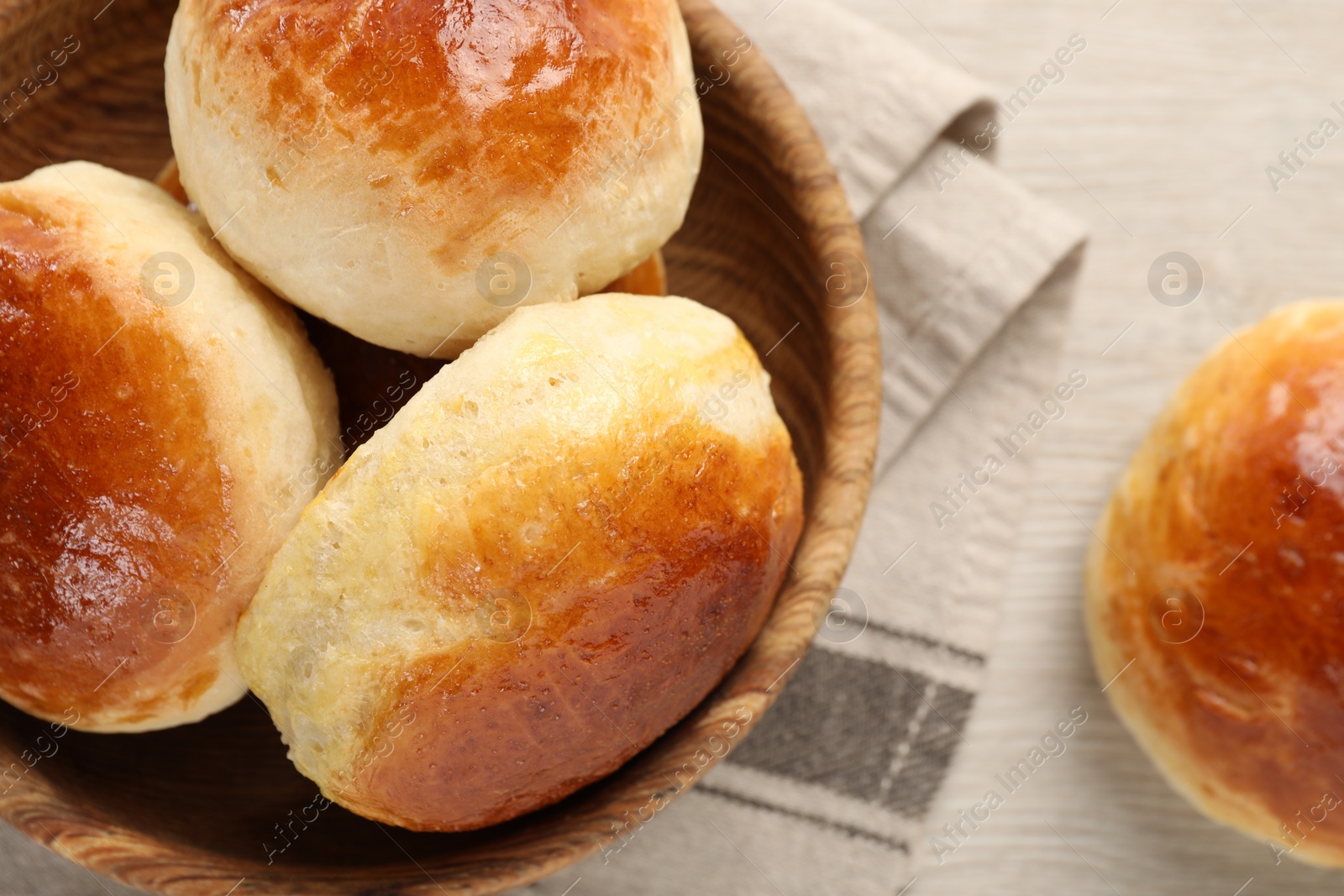 Photo of Freshly baked soda water scones on white wooden table, flat lay and space for text