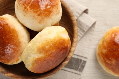 Photo of Freshly baked soda water scones on white wooden table, flat lay and space for text