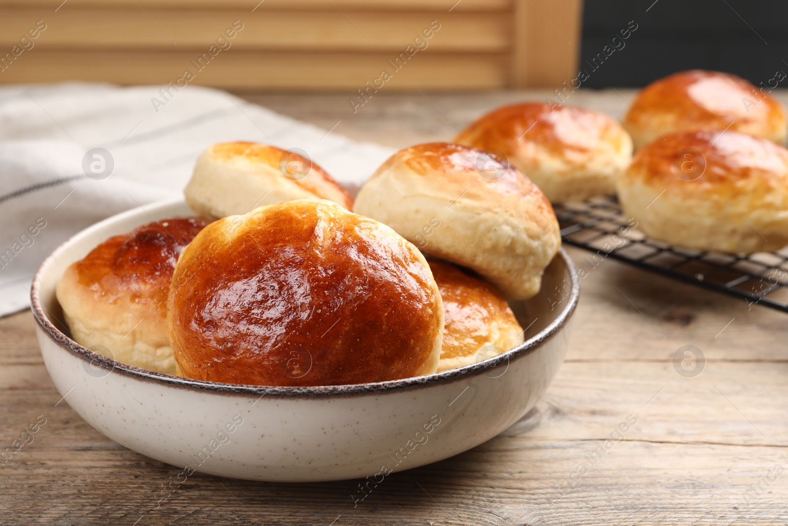 Photo of Tasty scones prepared on soda water on wooden table, space for text