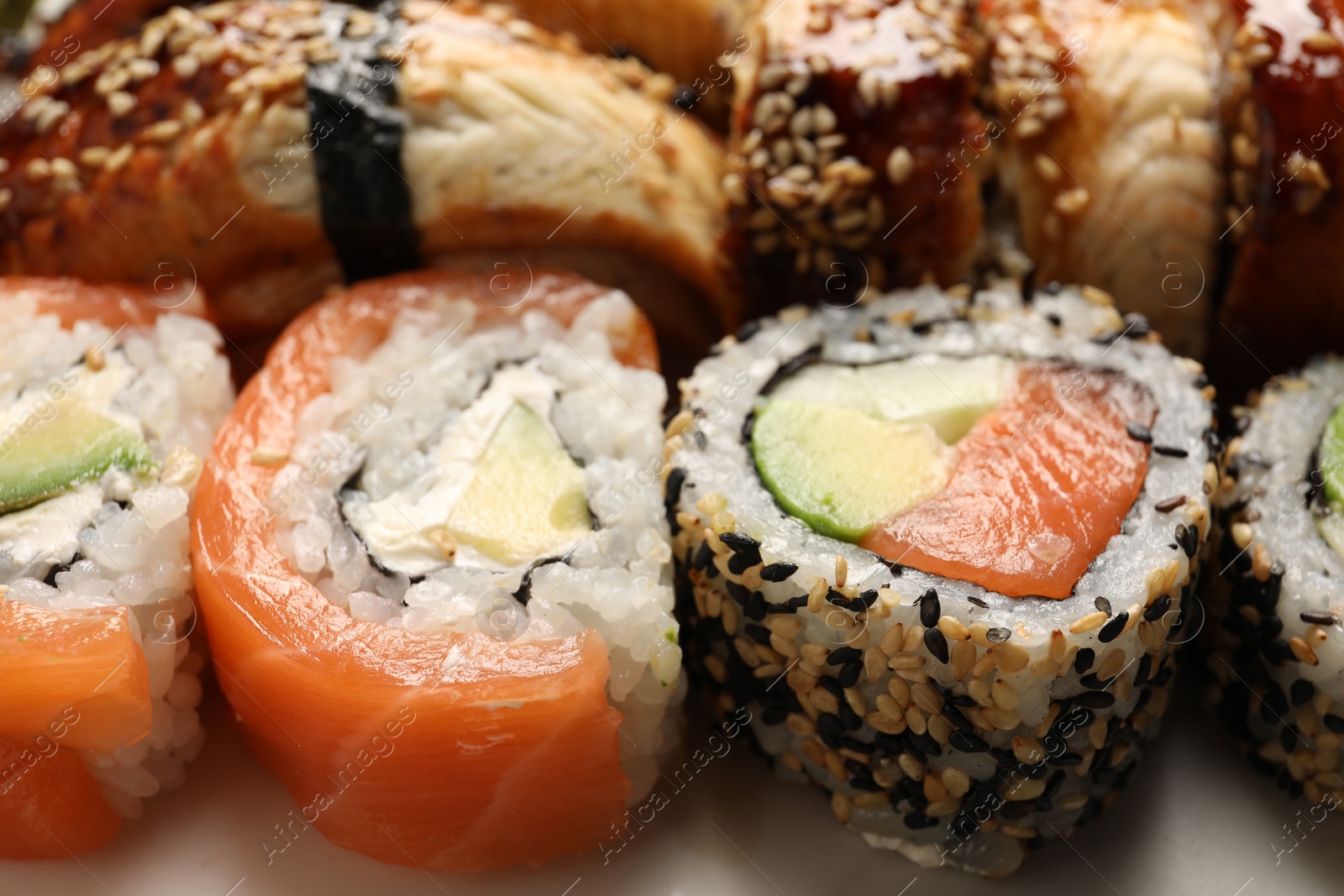 Photo of Set of delicious sushi rolls, closeup view