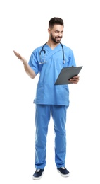 Young male doctor in uniform with clipboard isolated on white