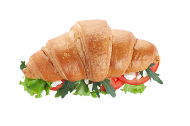 Tasty croissant sandwich with feta cheese and tomato isolated on white, top view