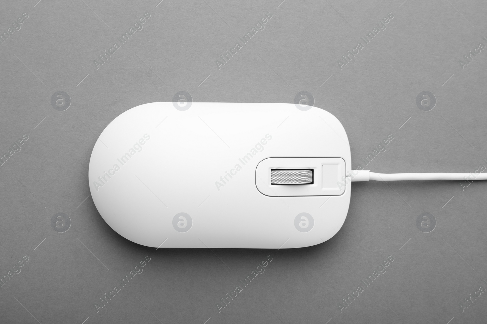 Photo of Modern wired computer mouse on grey background, top view