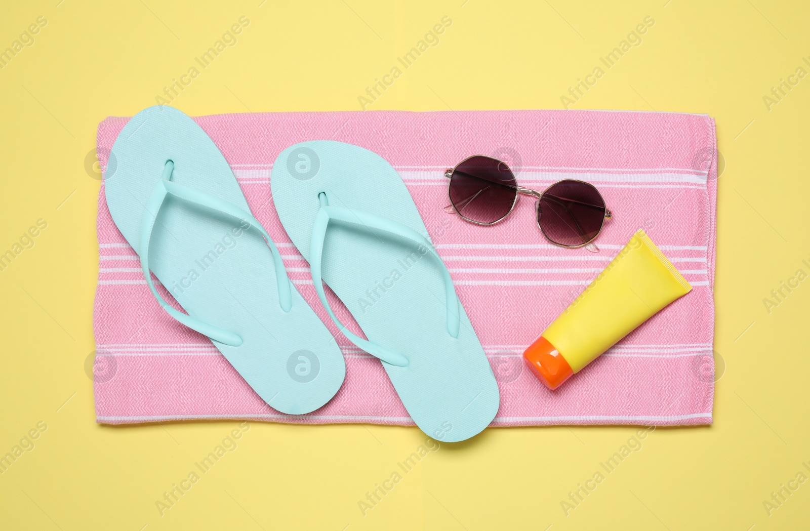 Photo of Flat lay composition with beach objects on background