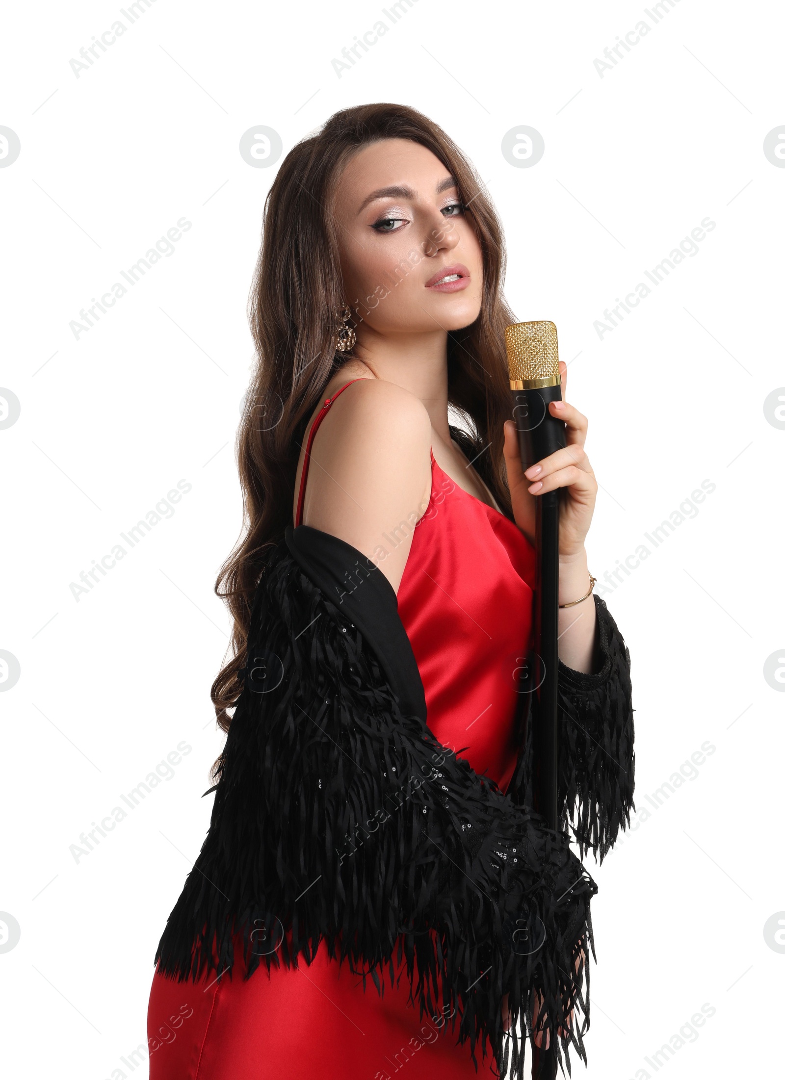 Photo of Beautiful young woman in stylish dress with microphone singing on white background
