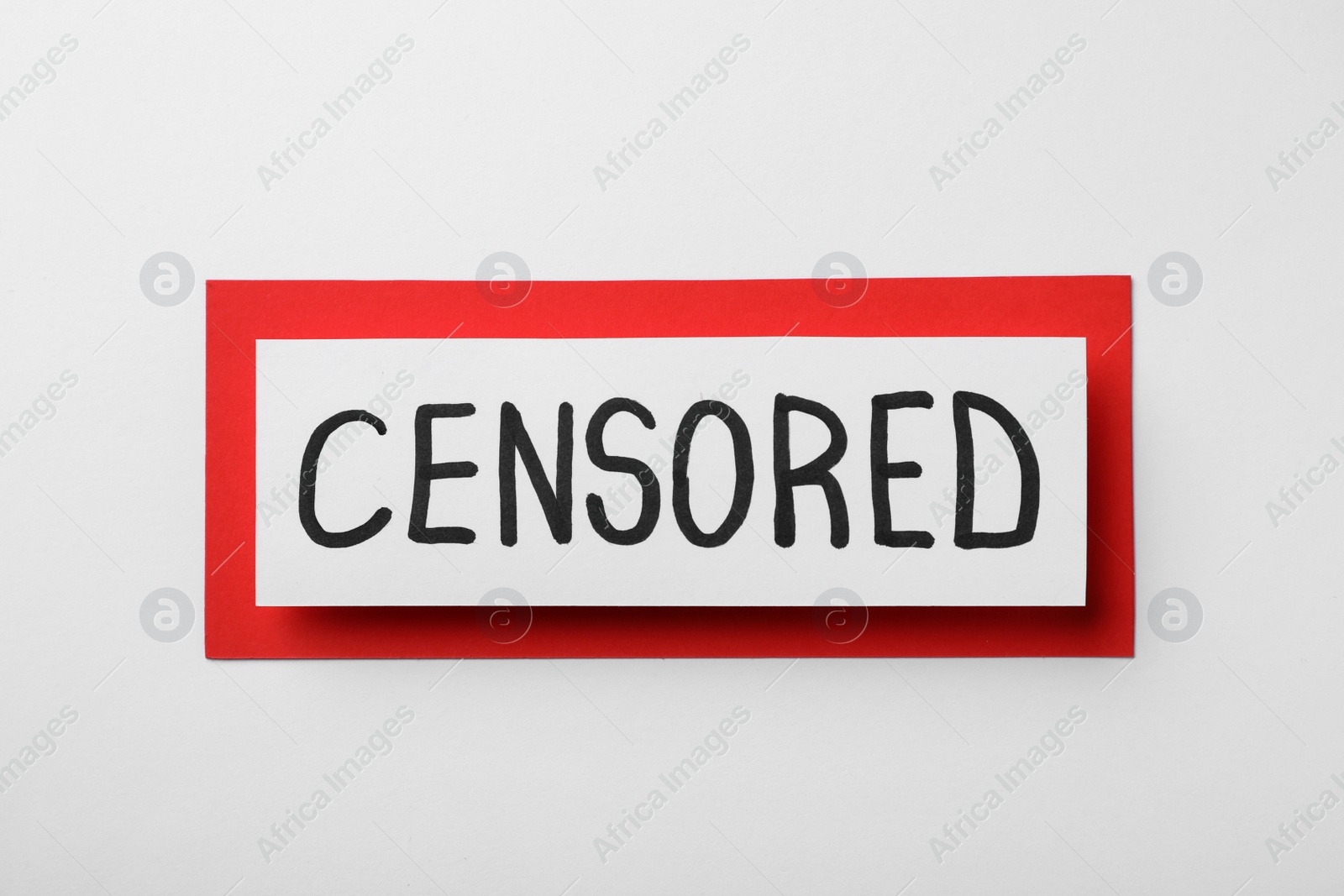 Photo of Card with word Censored on white background, top view