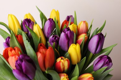 Photo of Bouquet of colorful tulips on white background, closeup