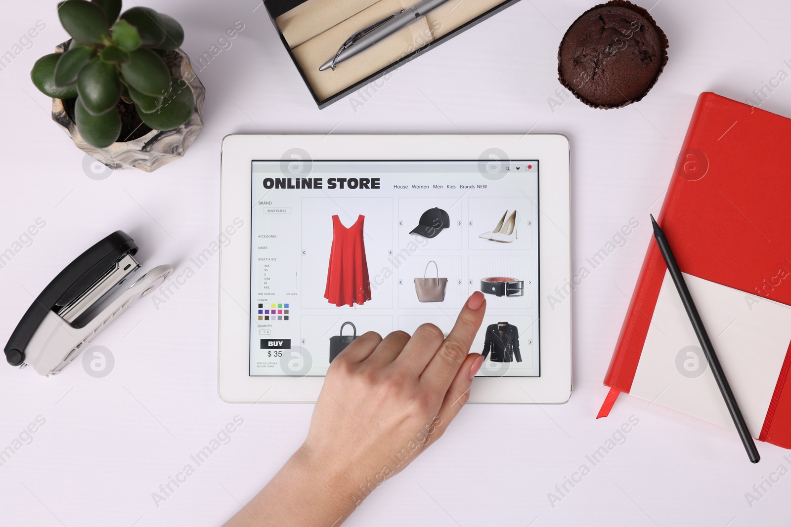 Photo of Woman with tablet shopping online on white background, top view