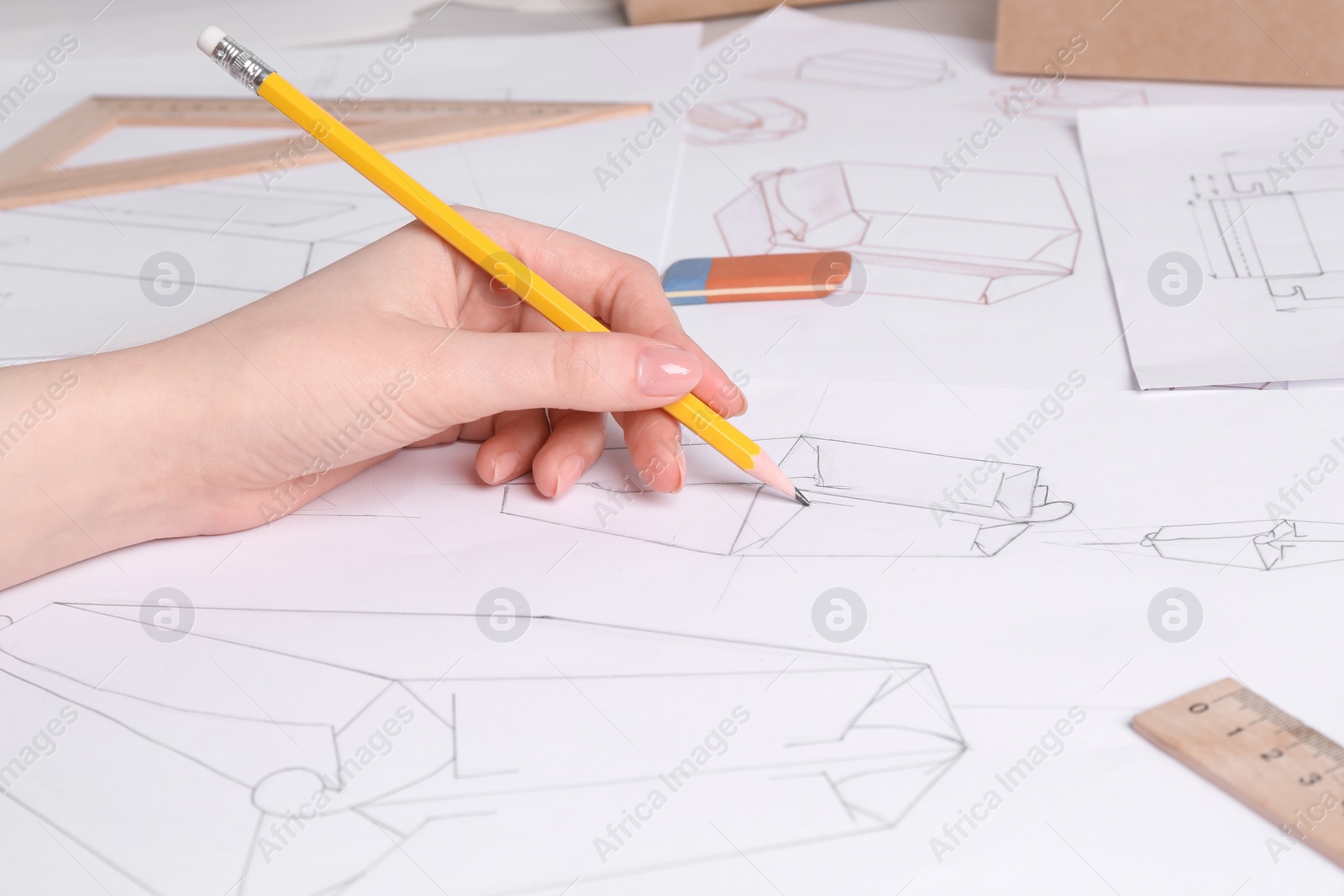 Photo of Woman creating packaging design at table, closeup